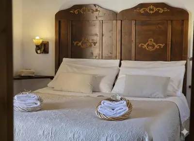 Letto o letti in una camera di S'Arrosa de Monti