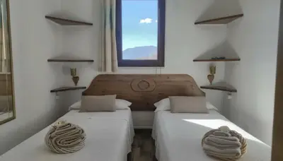 Letto o letti in una camera di S'Arrosa de Monti