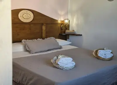 Letto o letti in una camera di S'Arrosa de Monti