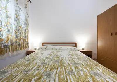 Letto o letti in una camera di Villa LuisaAnna