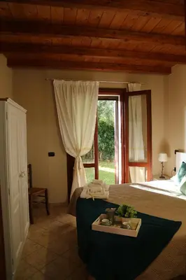 Letto o letti in una camera di Villa Cruccuris
