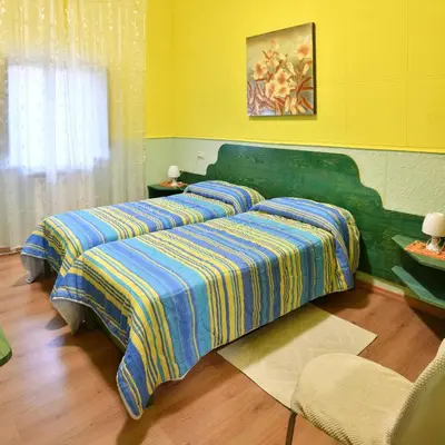 Letto o letti in una camera di B&B Mitzixeddas Sa Domu de Braxia