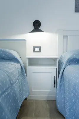 Letto o letti in una camera di ittiturismo S.Croce