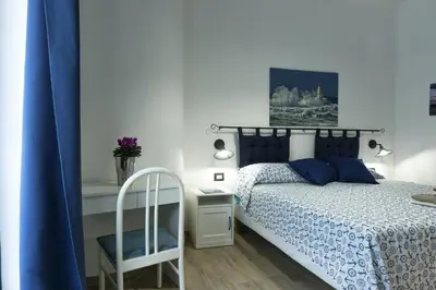 Letto o letti in una camera di ittiturismo S.Croce