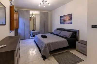 Letto o letti in una camera di Via Figoli Apartment