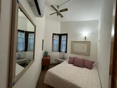 Letto o letti in una camera di Villa Ginepro Sardegna Santa Margherita di Pula mare blu