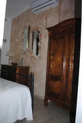 Letto o letti in una camera di Casa Claudia Villasimius