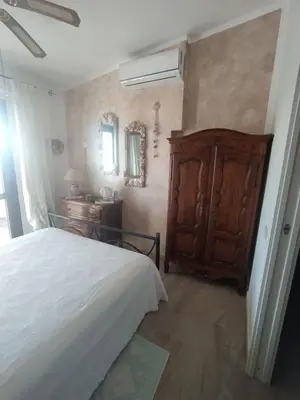 Letto o letti in una camera di Casa Claudia Villasimius