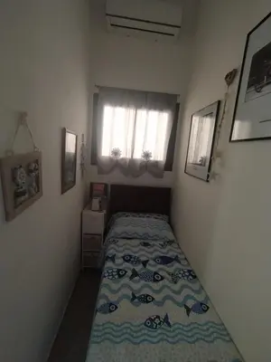 Letto o letti in una camera di Casa Claudia Villasimius