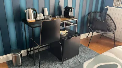 Set per la preparazione di tè e caffè presso KeRo Luxury Rooms