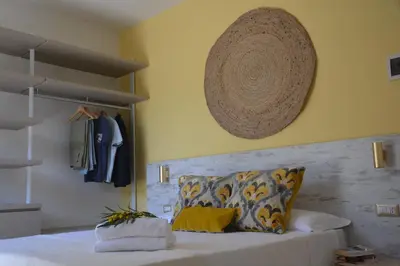 Letto o letti in una camera di Hotel Maison del Sole