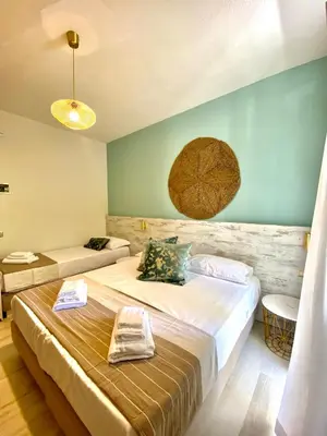 Letto o letti in una camera di Hotel Maison del Sole