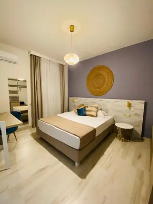 Letto o letti in una camera di Hotel Maison del Sole