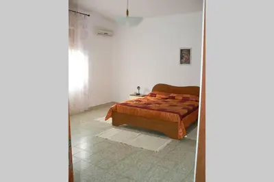 Letto o letti in una camera di Mariangela's Home