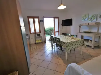 TV o dispositivi per l'intrattenimento presso Villetta con giardino in Residence IN CENTRO