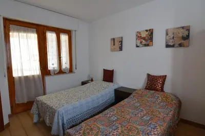 Letto o letti in una camera di casa vacanze I GIRASOLI