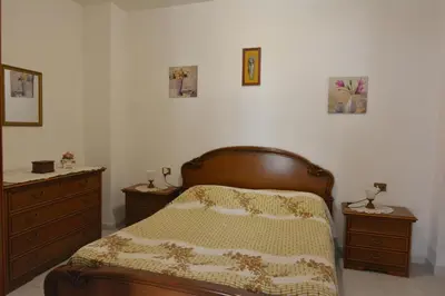 Letto o letti in una camera di casa vacanze I GIRASOLI
