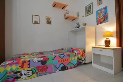 Letto o letti in una camera di casa vacanze I GIRASOLI
