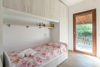 Letto o letti in una camera di CASA ZEN A GEREMEAS