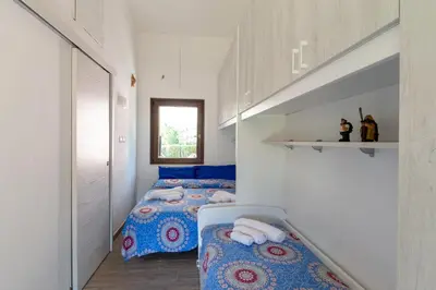 Letto o letti in una camera di CASA ZEN A GEREMEAS