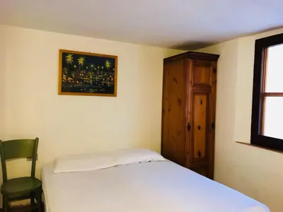 Letto o letti in una camera di Villetta al Mare circondata dal Verde (Carloforte - Spalmatore)
