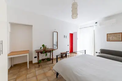 Letto o letti in una camera di Casa Marina Guesthouse Cagliari