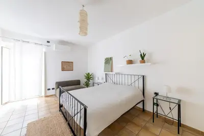 Letto o letti in una camera di Casa Marina Guesthouse Cagliari