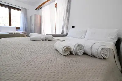 Letto o letti in una camera di RELAX MAREMONTI Ampia e Panoramica con spaziosa Veranda Attrezzata