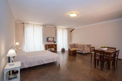 Letto o letti in una camera di Residenze al Castello Apartments