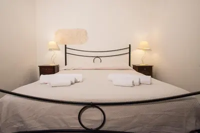 Letto o letti in una camera di Residenze al Castello Apartments