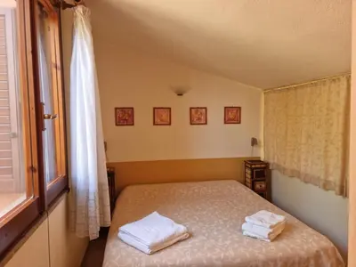 Letto o letti in una camera di Verde e Mare