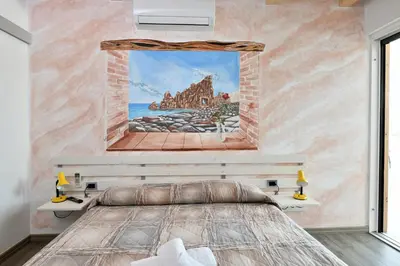 Letto o letti in una camera di Villa Sara