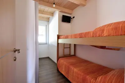 Letto o letti in una camera di Villa Sara