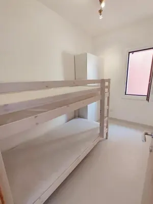 Letto o letti in una camera di Domo Allegru