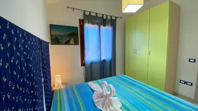 Letto o letti in una camera di Costa Rei Villetta 4 posti con Giardino privato e Parcheggio a 350m dalla Spiaggia