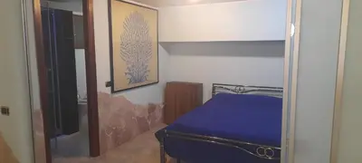 Letto o letti in una camera di Brezza di mare appartamento in Villa con giardino e spiaggia ,casa vacanze al mare