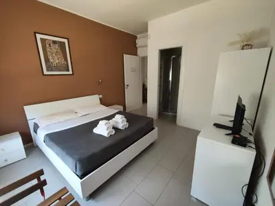 Letto o letti in una camera di Il Giardino di Anna - Charming rooms in Cagliari