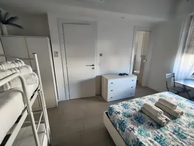 Letto o letti in una camera di Il Giardino di Anna - Charming rooms in Cagliari