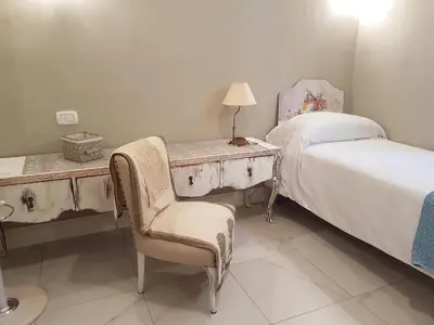 Letto o letti in una camera di VILLA LIBERTY OFELIA locazioni brevi