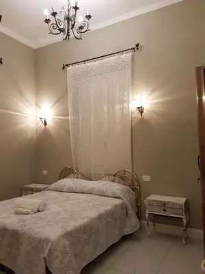 Letto o letti in una camera di VILLA LIBERTY OFELIA locazioni brevi