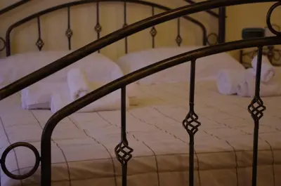 Letto o letti in una camera di Casa De Ajala - B&B de Charme in Antica Dimora totalmente ristrutturata e dotata di tutti i confort Bagni privati Spazio living Patio esterno Ambienti climatizzati Degustazioni prodotti locali