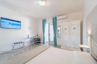 Letto o letti in una camera di Angolo Mare Apartments & Rooms