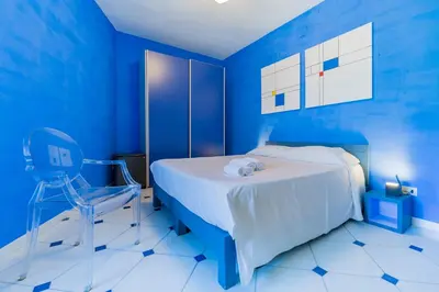 Letto o letti in una camera di Four Rooms