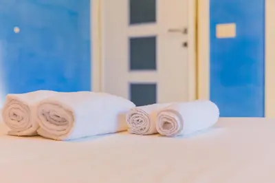 Letto o letti in una camera di Four Rooms