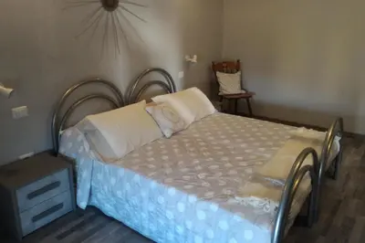 Letto o letti in una camera di Corona Bed & Breakfast
