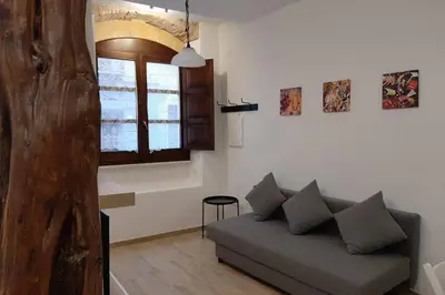 Area soggiorno di Casetta ALU' - il tuo nido a Stampace