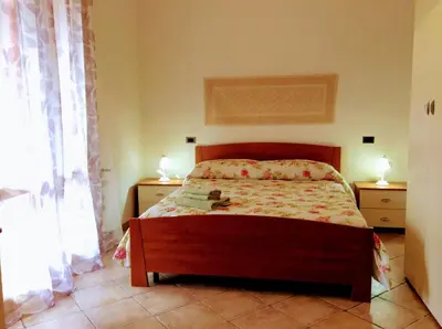 Letto o letti in una camera di Il mirto e l'oleandro