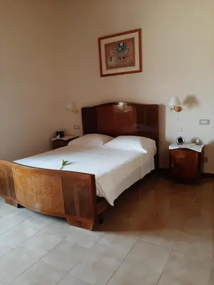 Letto o letti in una camera di Villa Mostallino