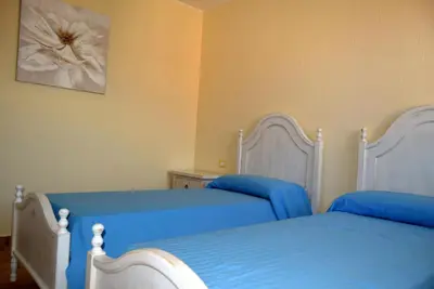 Letto o letti in una camera di casa AGORA By La Via Del Mare Viaggi e Vacanze