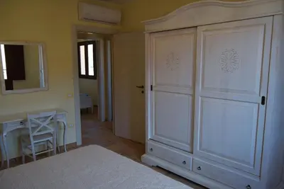 Letto o letti in una camera di casa AGORA By La Via Del Mare Viaggi e Vacanze